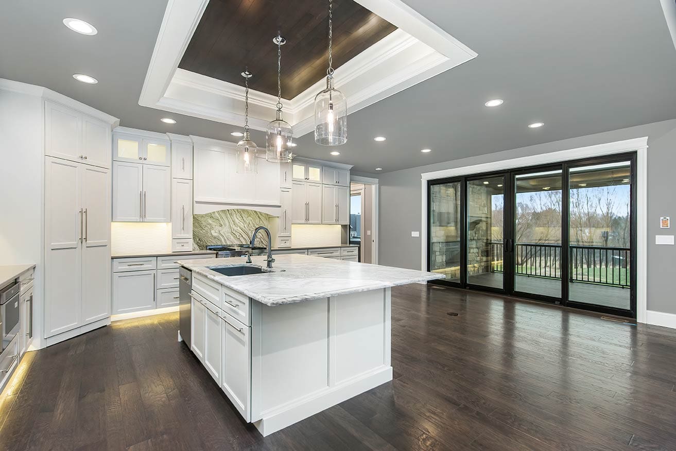 Finished white kitchen with island, Quad Cities, after
